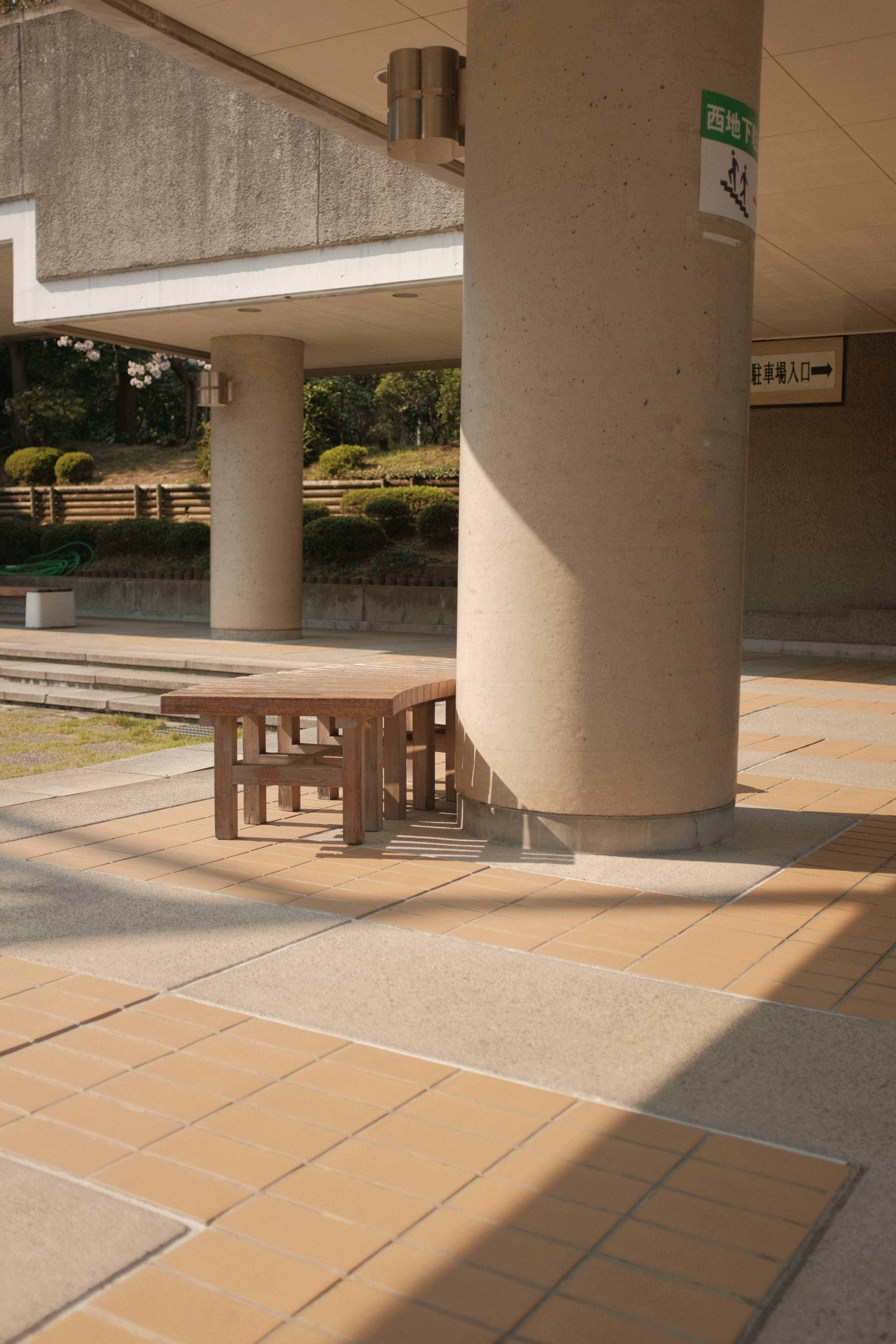 brown wooden table and chairs on gray concrete floor